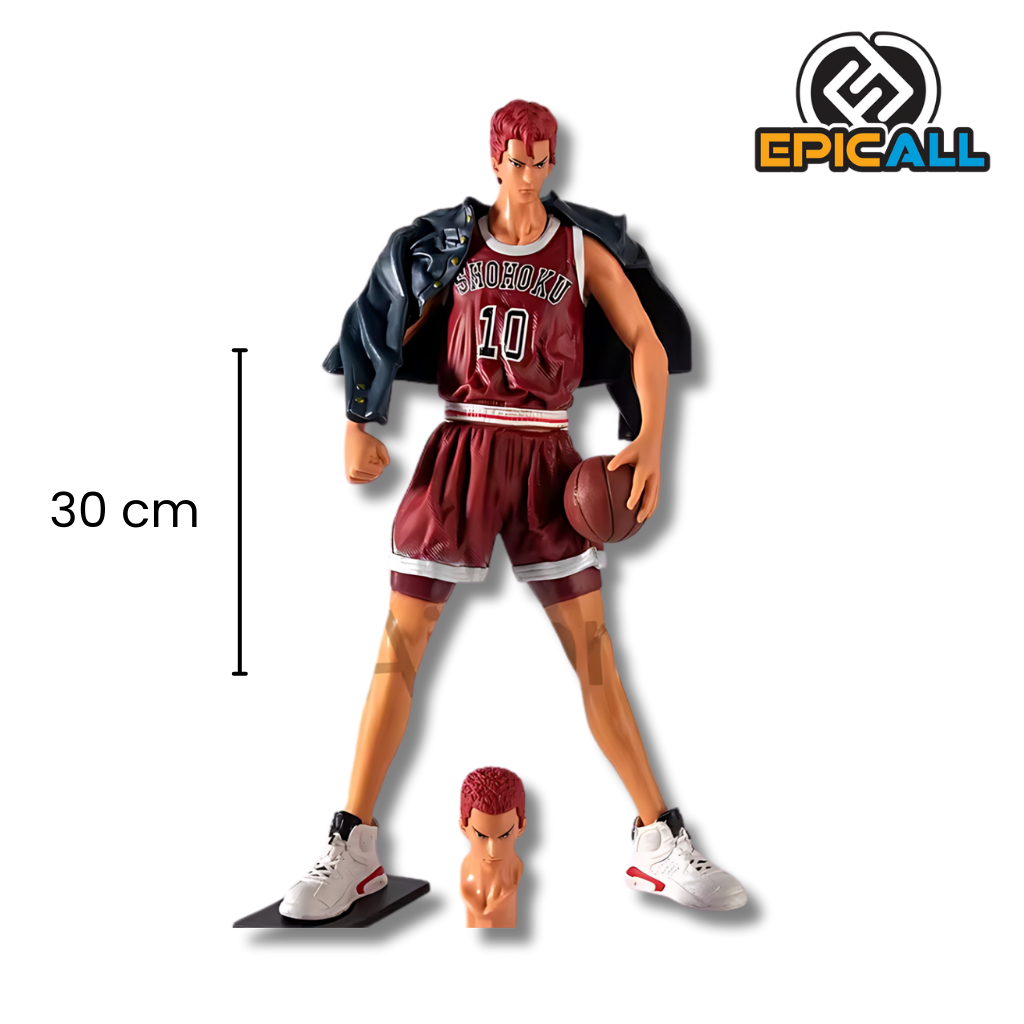 Una figura de acción de Hanamichi Sakuragi, un personaje del anime Slam Dunk. La figura representa a Sakuragi en una pose de juego de baloncesto, con el brazo levantado para lanzar una pelota imaginaria. Tiene el cabello rojo característico y viste el uniforme de su equipo.