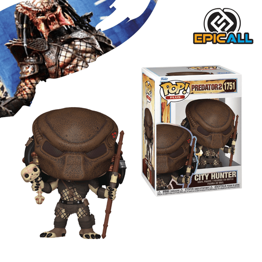 Un Funko POP del Predator City Hunter. La figura tiene una máscara facial marrón con ranuras, rastas que caen por la espalda, y armadura detallada de color gris oscuro y bronce. Sostiene un bastón largo con una calavera al final en su mano izquierda. La figura tiene los ojos grandes y redondos, característicos de los Funko POP. La caja del Funko POP se ve detrás de la figura.