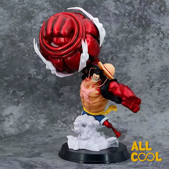 Estatua de un personaje de anime, Luffy, en una pose de lucha. Tiene un brazo gigante y musculoso de color rojo. La estatua está sobre una base circular y mide 30 centímetros de alto.