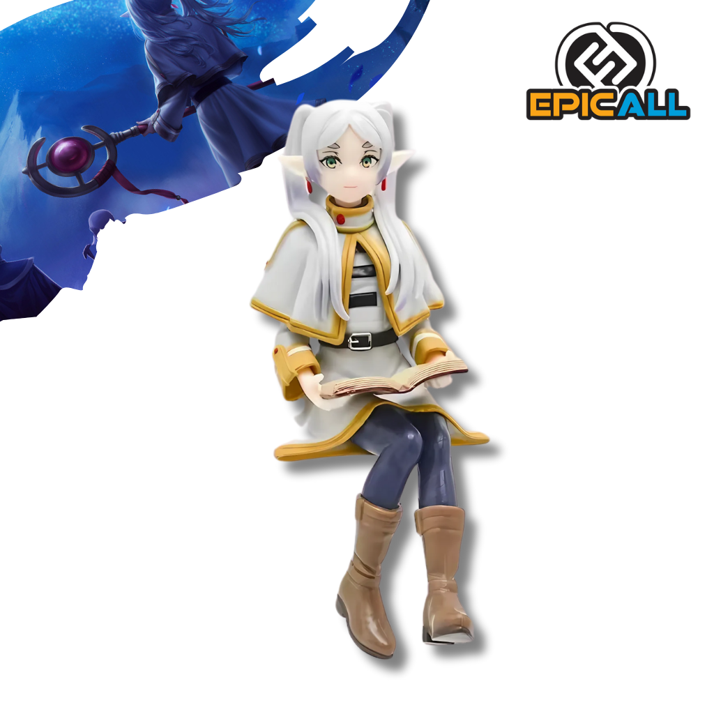 Una figura de Frieren, una elfa de cabello blanco y ojos azules, sentada sobre un libro. Lleva un vestido blanco y azul y está leyendo un libro. La figura está diseñada para ser utilizada como tope de ramen.