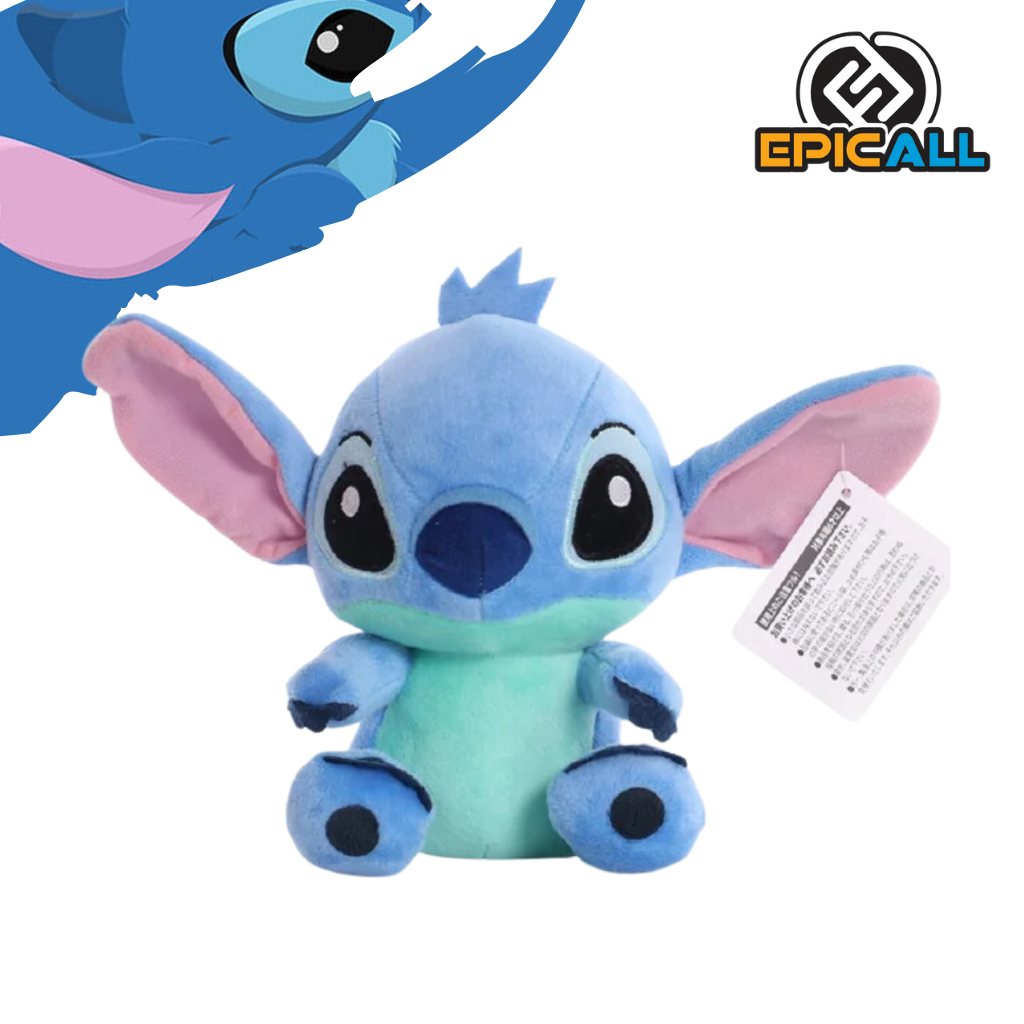 Un peluche de Stitch, un personaje de la película de Disney Lilo & Stitch. Es de color azul con detalles blancos y rosas. Tiene una forma redonda y amigable, con grandes orejas y ojos. Su expresión es juguetona y traviesa.