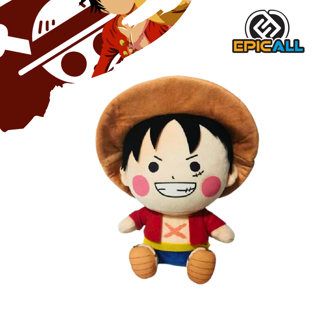 Un peluche de Luffy, el protagonista del anime y manga One Piece. Es de color rojo y blanco, con un sombrero de paja y una gran sonrisa. Tiene un diseño kawaii y redondeado.