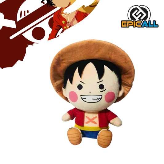 Un peluche de Luffy, el protagonista del anime y manga One Piece. Es de color rojo y blanco, con un sombrero de paja y una gran sonrisa. Tiene un diseño kawaii y redondeado.