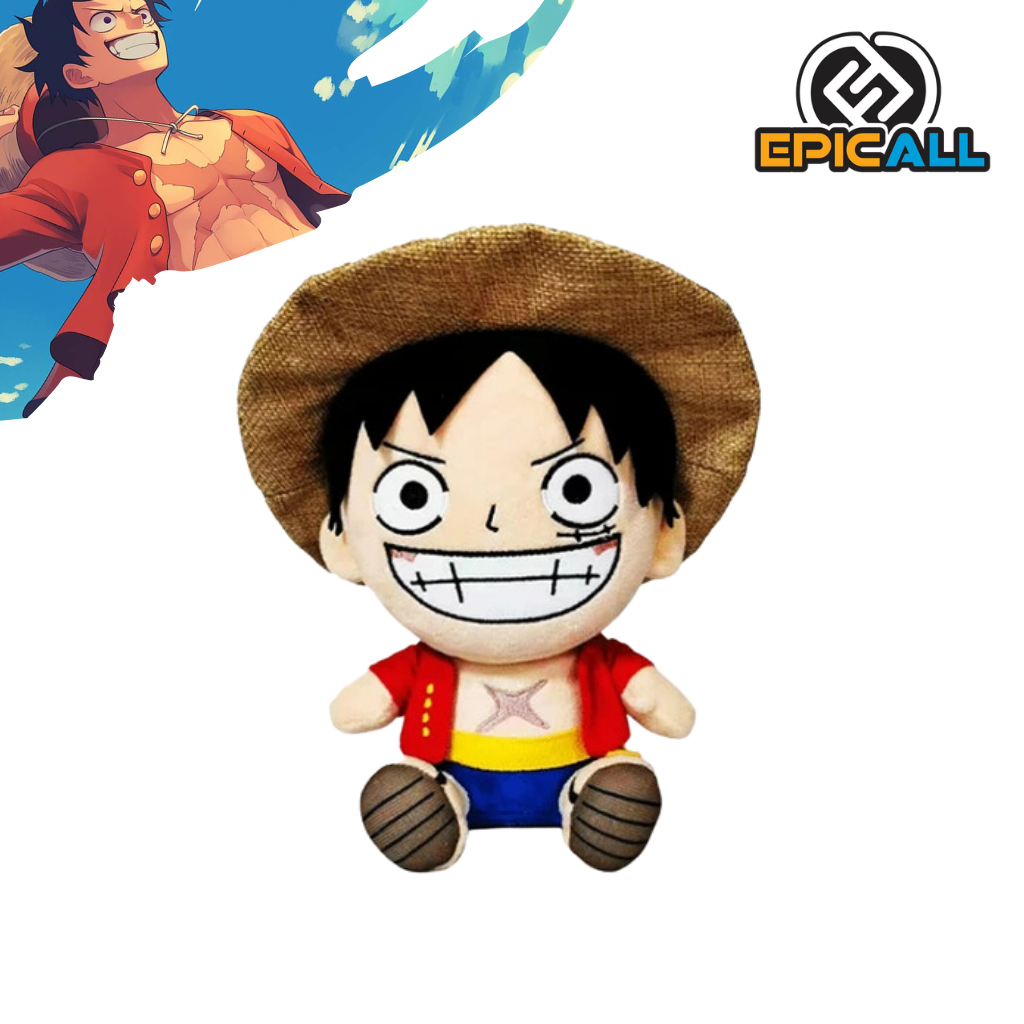 Un peluche de Luffy, el protagonista del anime y manga One Piece. Es de color rojo y blanco, con un sombrero de paja y una gran sonrisa. Tiene un diseño kawaii y redondeado.