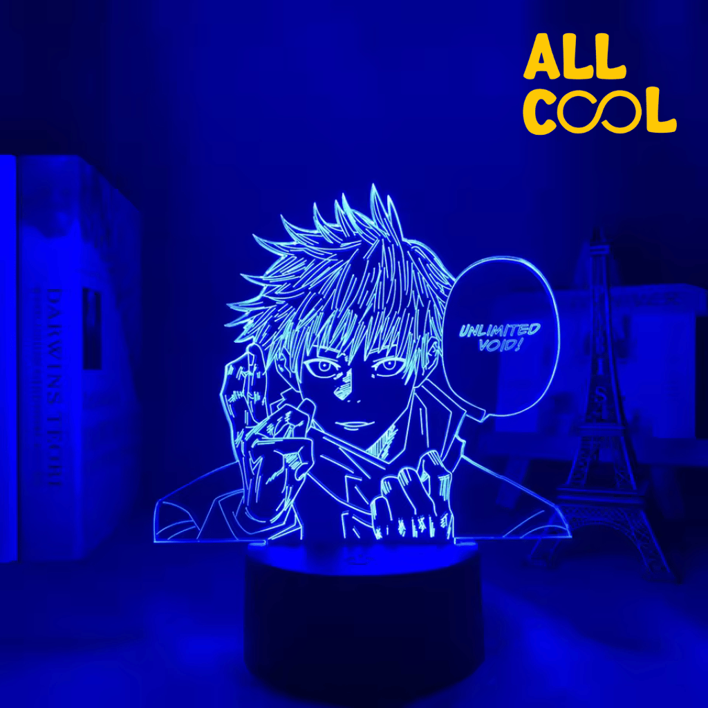 Una lámpara LED con diseño 3D de Satoru Gojo, un personaje del anime Jujutsu Kaisen. La imagen muestra a Gojo con su característico parche en el ojo y la frase "Vacío Ilimitado" en un globo de diálogo. La lámpara tiene una base circular y emite una luz suave.