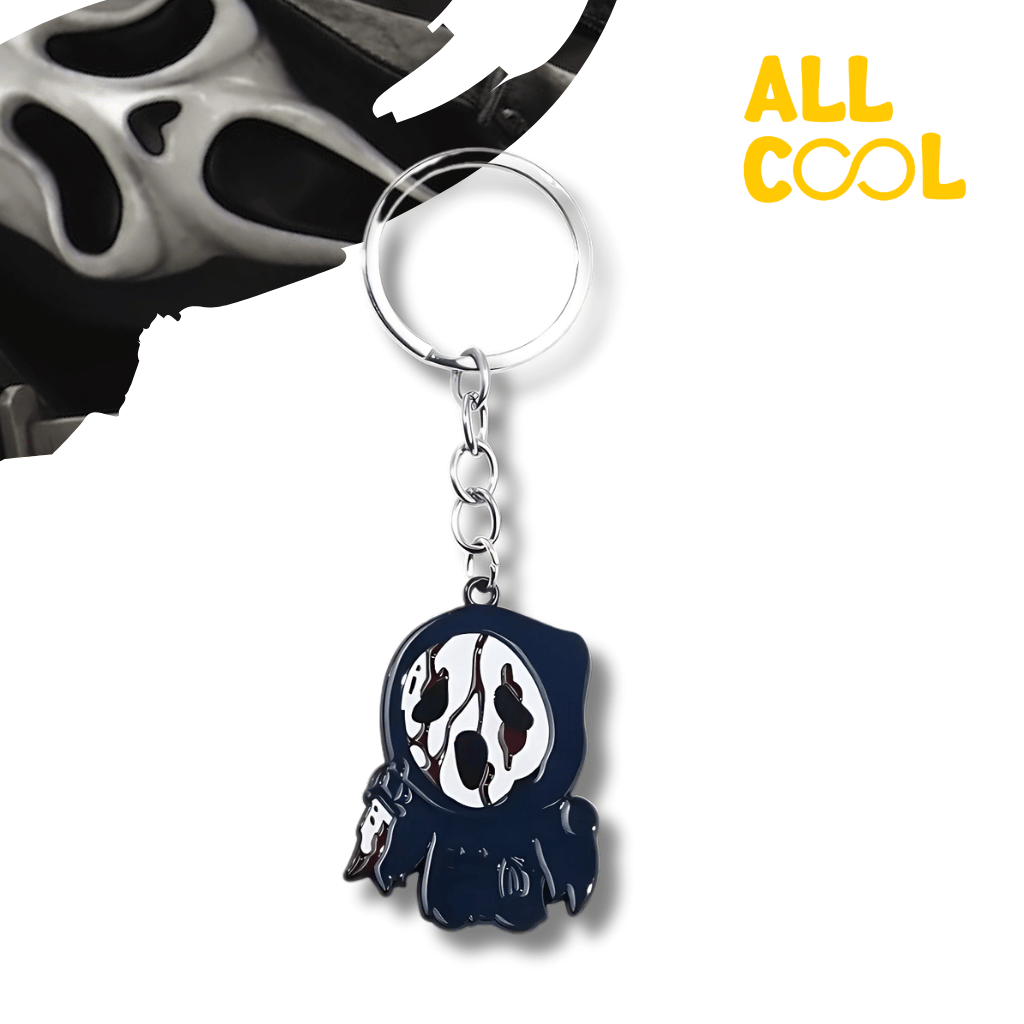 Llavero metálico con forma de Ghostface, un personaje de películas de terror. El llavero es de color negro y tiene detalles en blanco.