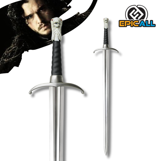 Réplica de la espada Garra de Jon Snow de Game of Thrones con hoja de acero brillante, empuñadura con cabeza de lobo blanco y su respectiva vaina negra.