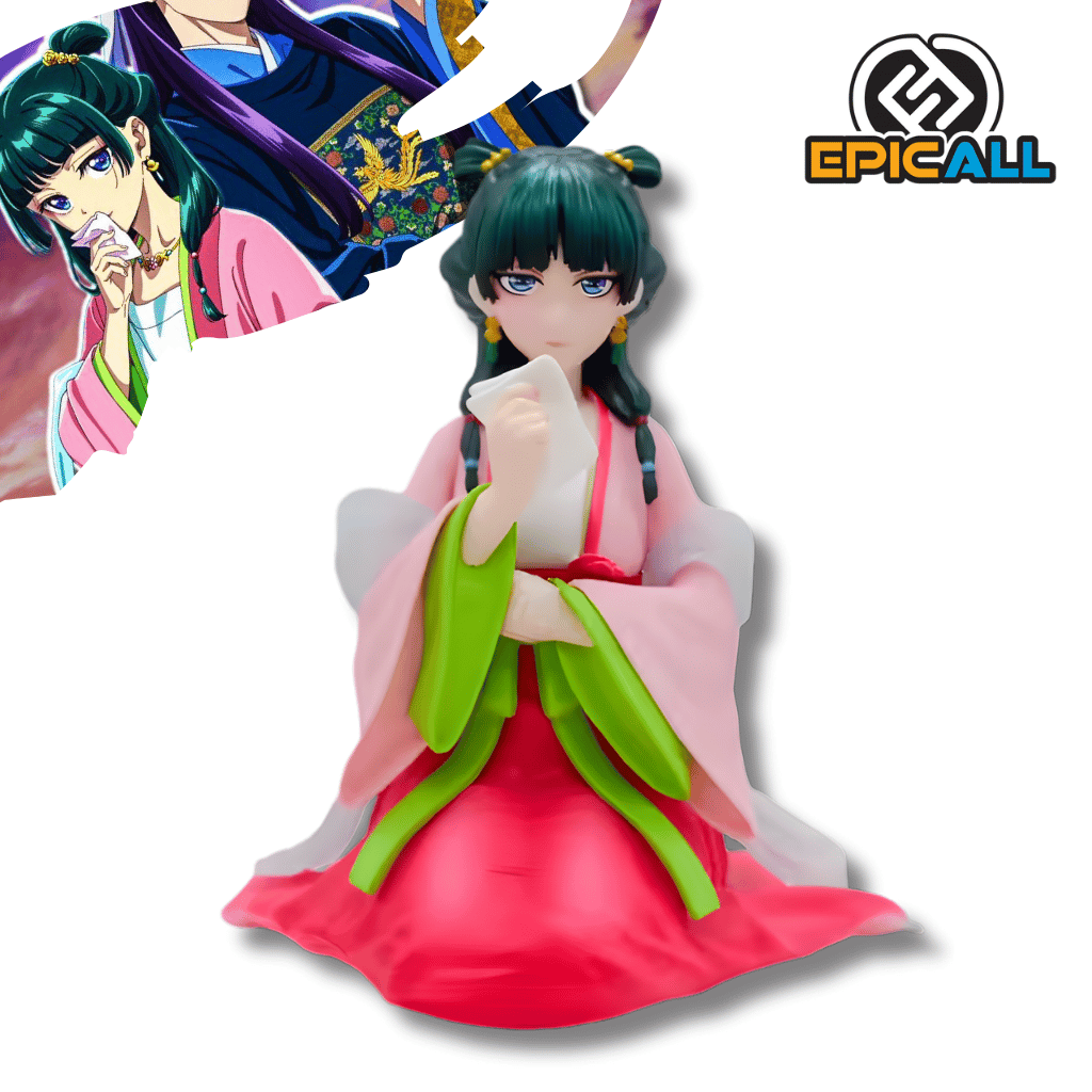 Figura de estatua de Maomao del anime Los Diarios de la Boticaria. El personaje aparece sentado con las piernas cruzadas ocultas por su kimono. Viste un traje tradicional compuesto por una túnica rosa sobre una falda roja, con amplias mangas de color verde brillante y un chal blanco translúcido. Maomao tiene el cabello oscuro recogido en dos moños laterales y sostiene un pequeño pañuelo blanco con su mano derecha cerca de su barbilla.