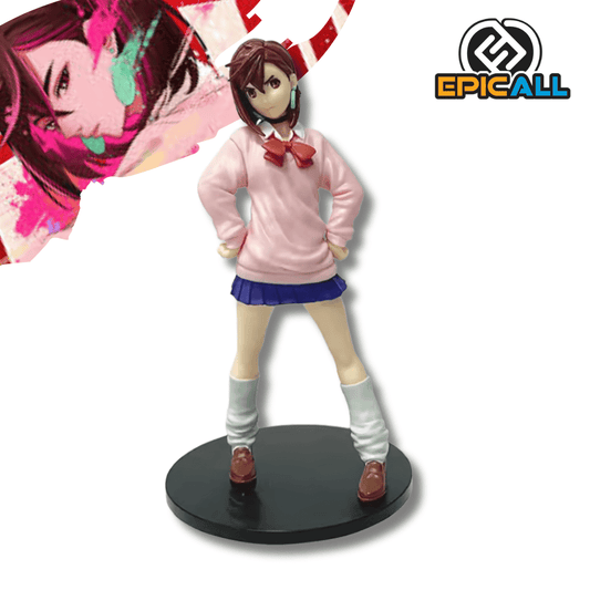 Una figura de estatua de Momo Ayase, la protagonista del manga DanDaDan, de unos 17 cm de altura. El personaje está de pie vistiendo su uniforme escolar y tiene una expresión decidida.