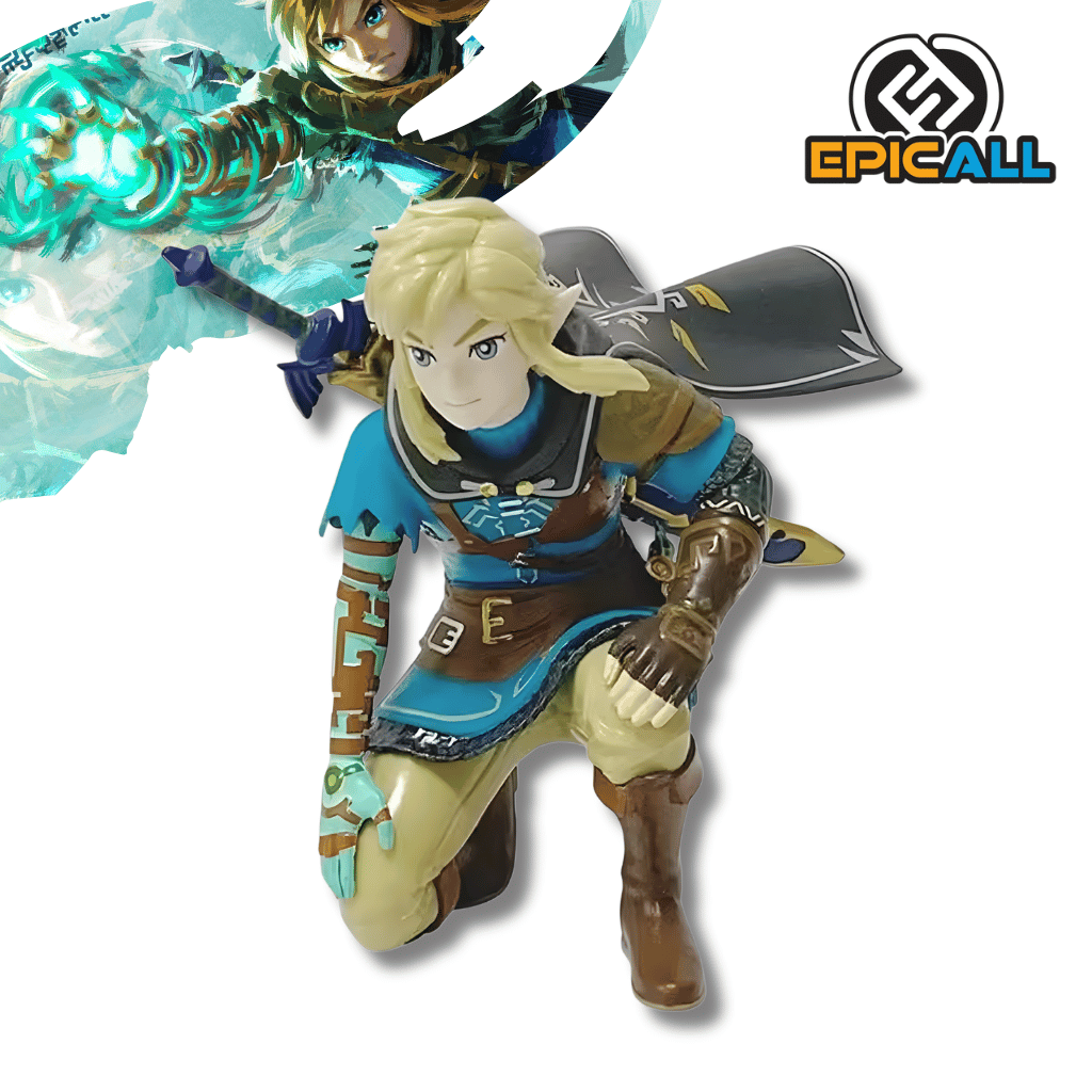 Figura de colección de Link del videojuego The Legend of Zelda: Tears of the Kingdom de 12 cm de altura. El héroe aparece en una pose arrodillada sobre una pierna, vistiendo su túnica azul con detalles marrones y una capa oscura ondeante detrás. Su brazo derecho muestra grabados de color turquesa, y en su espalda se asoma la empuñadura de su espada. La figura tiene un acabado detallado en el cabello rubio y los rasgos del rostro.